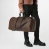 louis-vuitton-keepall-bandouli_C3_A8re-55-monogram-macassar-personalization-M56714_PM1_Cropped_20worn_20view-scaled-1.jpg Louis Vuitton Keepall Bandouliere 55 Black M56714